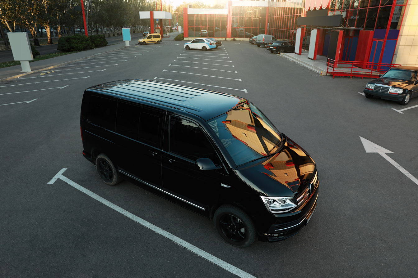 Black Van on Parking Lot at Sunset Outdoors